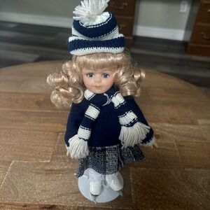 Skater porcelain doll with stand- The broadway collection